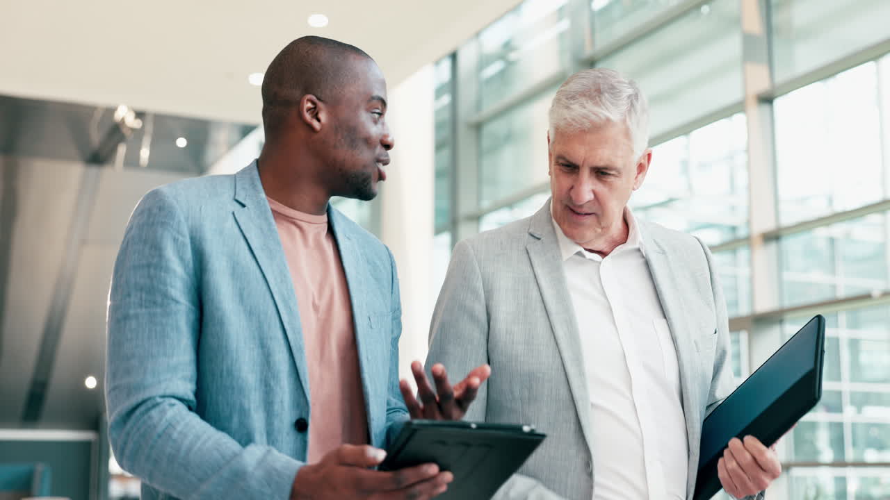 Tablet, walking business people