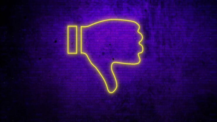 Insegna al neon pollice verso su muro di mattoni 4k
