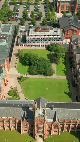 centered social ratio aerial video of queen's university, belfast on a bright and sunny day. filmed in 1080x1920, 60fps and with rec709 color