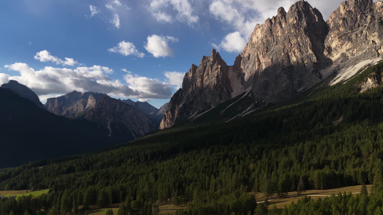 Dolomites mountain range at Cortina d Ampezzo, summer time aerial drone video. Touristic hotspot. Hiking, mountain adventures and beautifull views