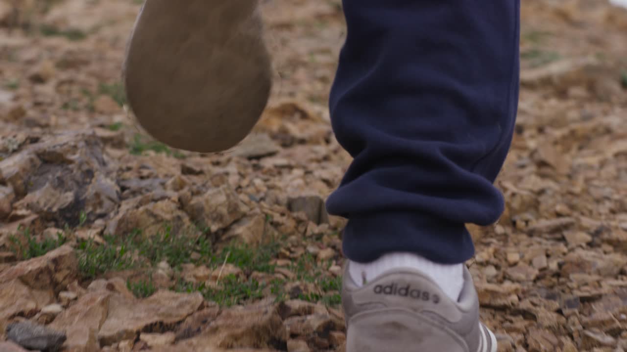 Person Hiking on a Rocky Trail