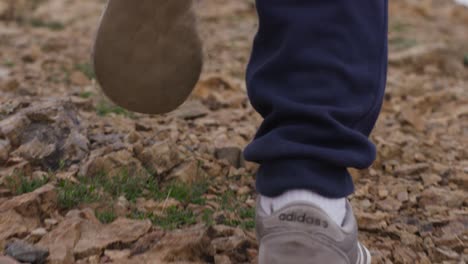 person hiking on a rocky trail