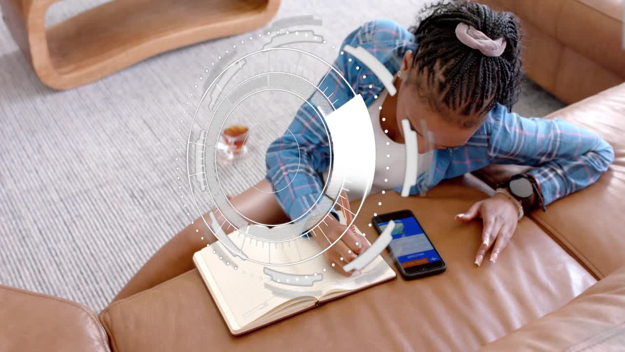 Woman on couch reaching for phone, writing notes while HUD expanding into data panels for education