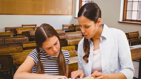 animation of biracial female teacher and caucasian schoolgirl over classroom