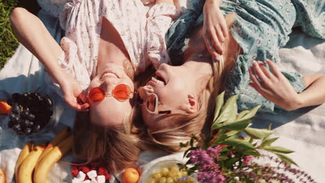 two friends enjoying a picnic