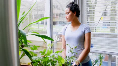 Thoughtful-woman-standing-in-the-balcony-4k