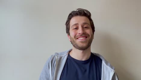 Young-Male-University-Student-Joining-Video-Lecture-and-Talking-to-Classmates