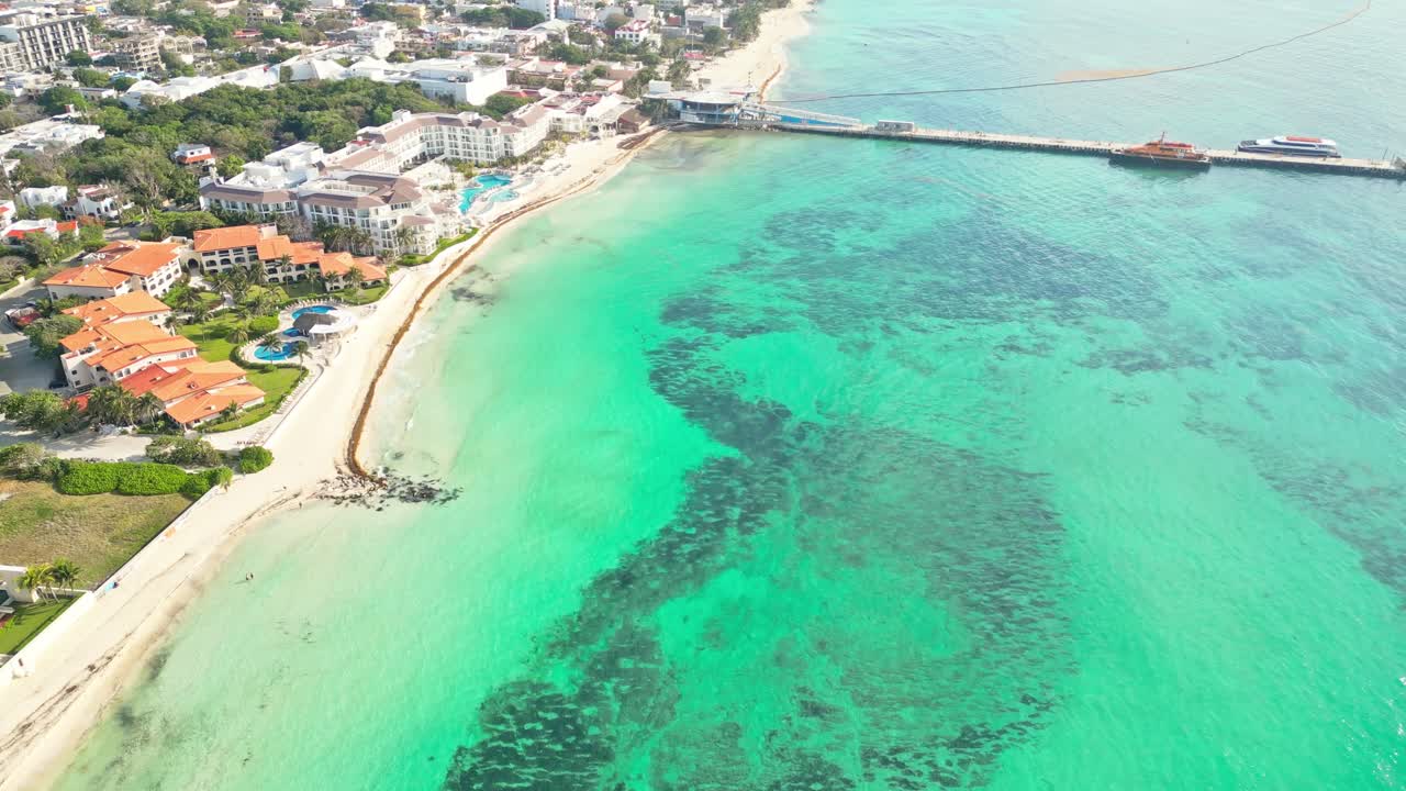 Sunny beach and turquoise ocean in Playa del Carmen, Mexico, seen from above