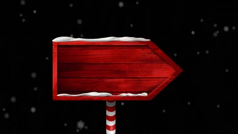 animation of wooden sign with copy space over snow falling