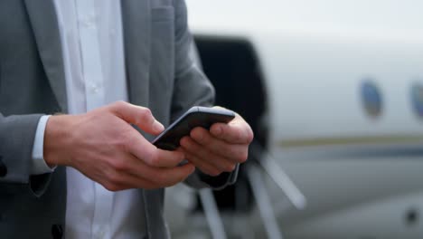 Businessman-using-mobile-phone-at-terminal-4k