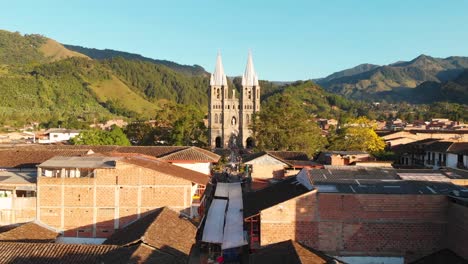 basilica of the immaculate conception catholic church over the small town of jardin with a low aerial dolly in columbia