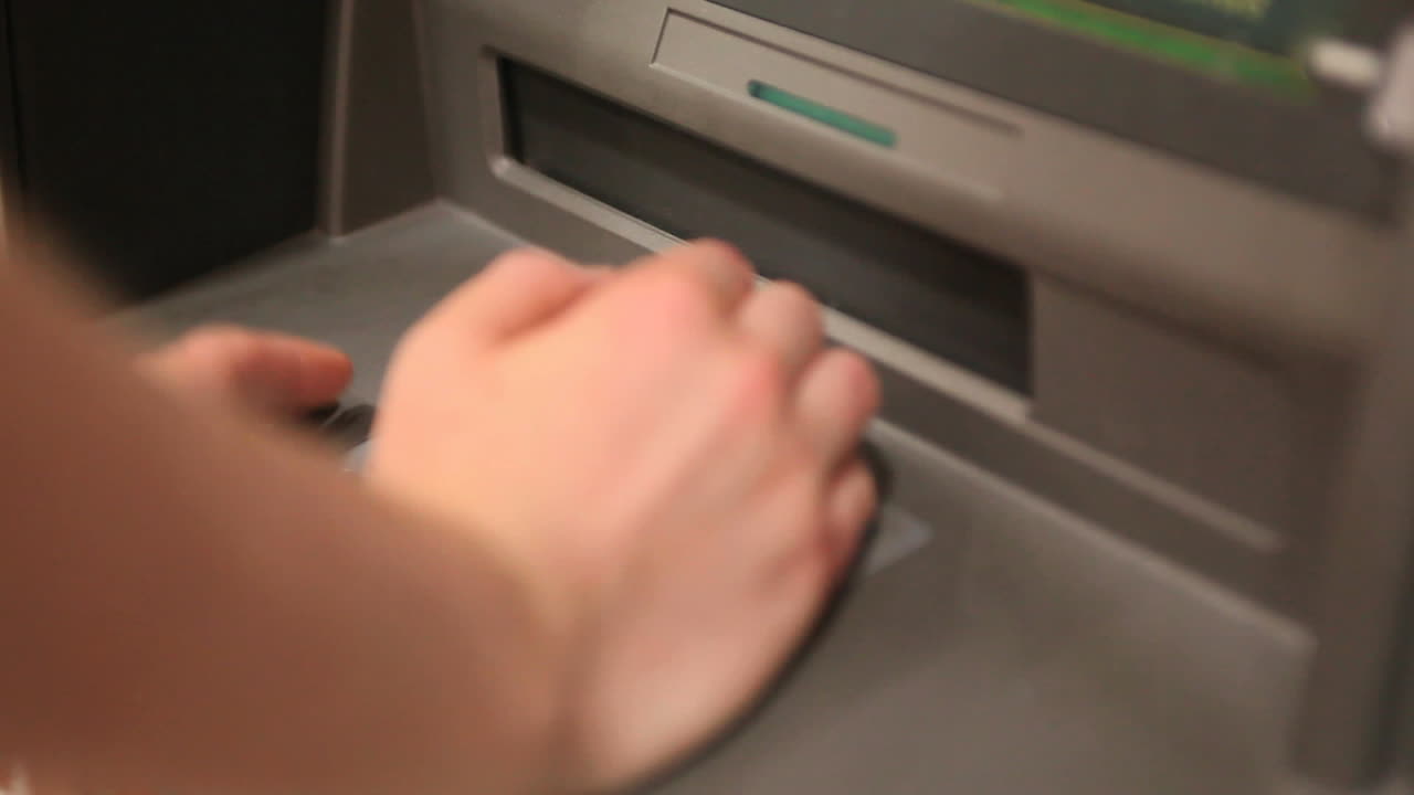 Person making a cash withdrawal
