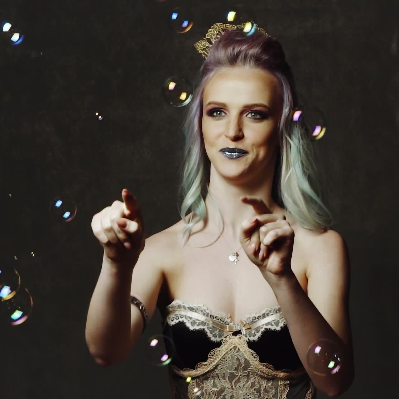 Woman blowing soap bubbles