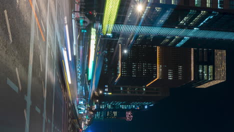 Busy-night-car-traffic-timelapse-in-Seoul-downtown-on-Jong-ro-street-by-Gwanghwamun-Station---Vertical-panning-motion