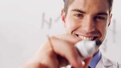 Man-writing-on-glass-with-marker-pen