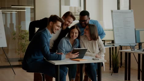 young diverse business team collaborating and smiling in modern office
