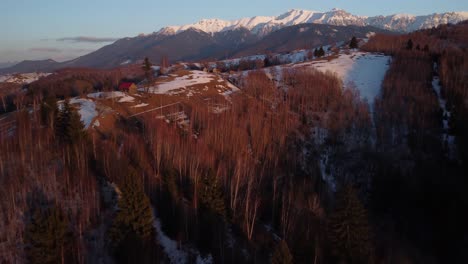 Sunset-over-the-village-of-Bran-during-the-winter