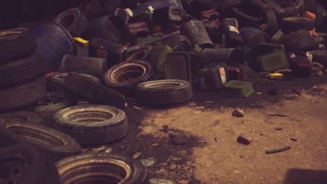 Debris of discarded tires and containers littering a neglected urban area