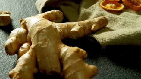 dried orange with ginger on a textile 4k