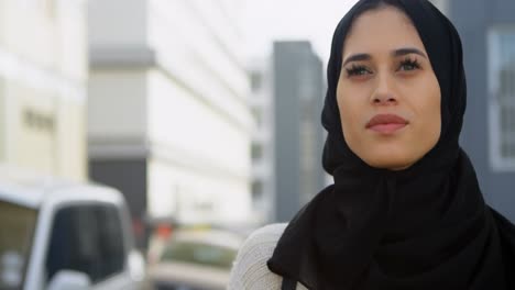 woman in hijab standing on the street 4k