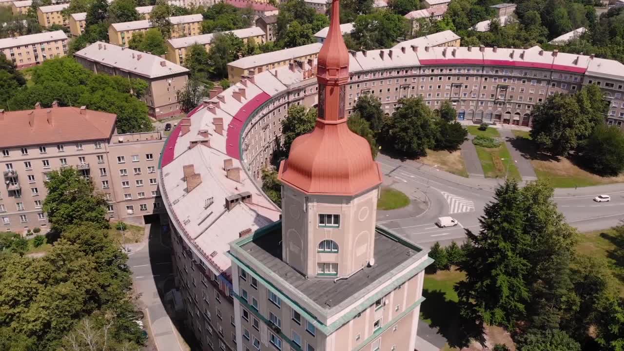 Aerial View of a City with a Unique Tower Building