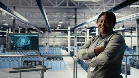portrait of smiling it professional in server farm optimizing machine learning