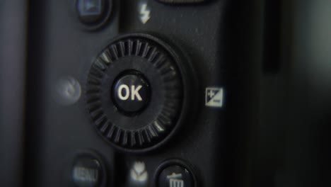 macro shot of a dslr camera, menu buttons close up, studio lighting, photography gear, slow motion 120 fps, full hd video, pan right movement