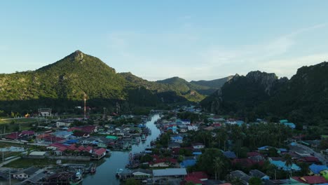 aerial footage on the right side of the river revealing the fishing village and a super lovely landscape