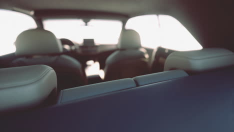 interior shot of a vehicle showcasing the dashboard and back seats