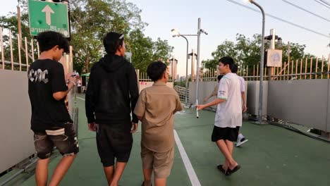 group of friends walking and chatting on a court