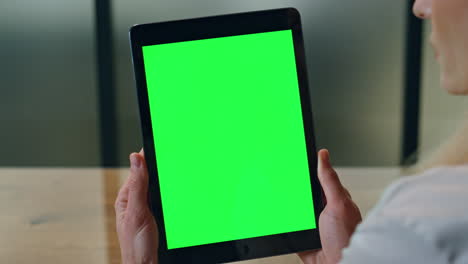 Woman-fingers-holding-mockup-tablet-office-close-up.-Lady-boss-reading-computer