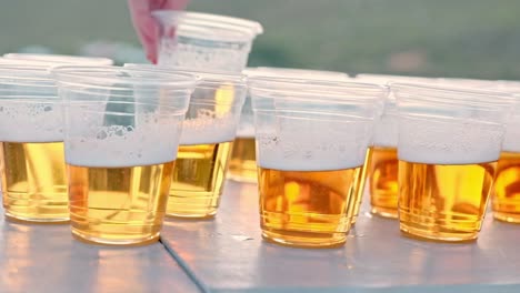 beer in plastic cups on a table for a drinking game