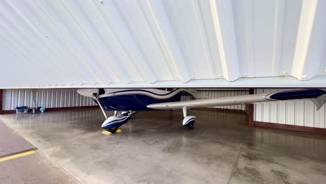 aircraft-hangar-door-is-closed-with-piper-cherokee-180-inside