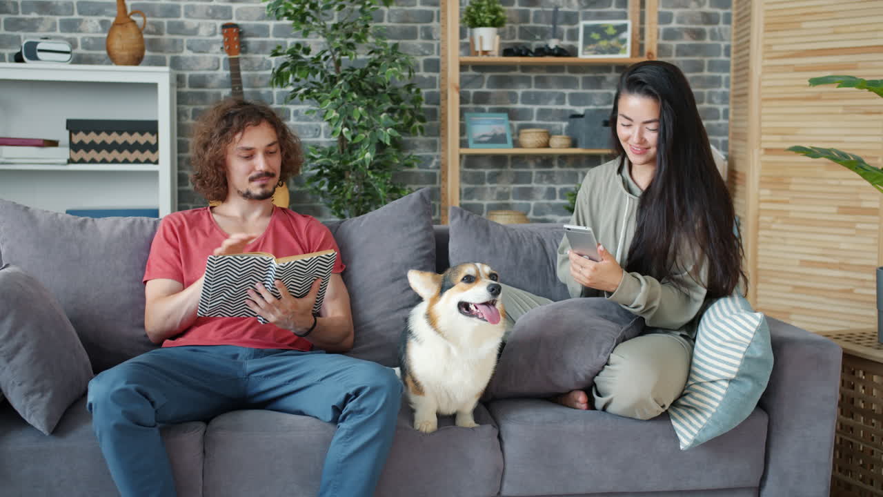 Couple Relaxing at Home with Dog