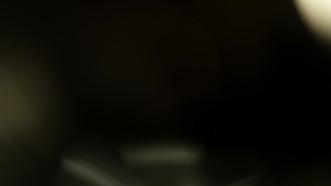 Abstract Light Leaks On Black Background.