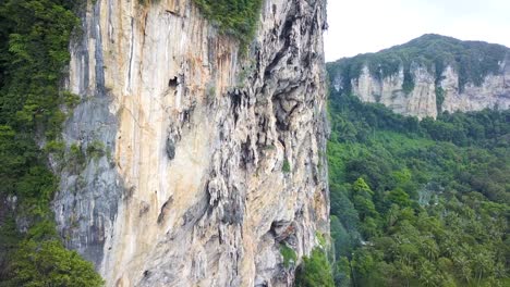 panning from bottom upwards, showing the rock climbing crags that krabi in southern thailand is world-famous for