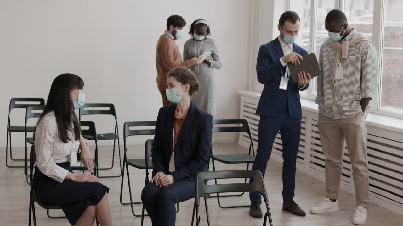 Colleagues Communicating in Conference Room