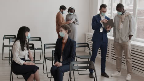 colleagues communicating in conference room