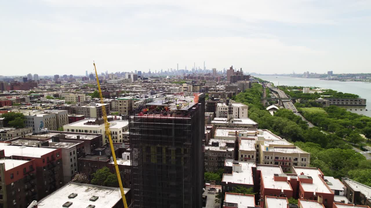 Active construction site with workers and crane, high rise building in ...