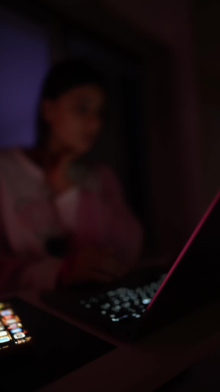A woman is using a laptop indoors