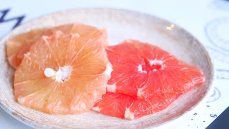 eating fresh grapefruits close up ,