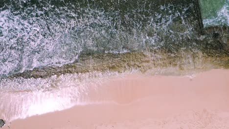 top shot of waves crashing at cromwells beach in kahala, oahu, hawaii