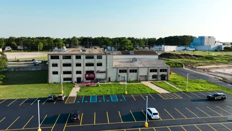 a marina parking lot in summer with blacktop cover