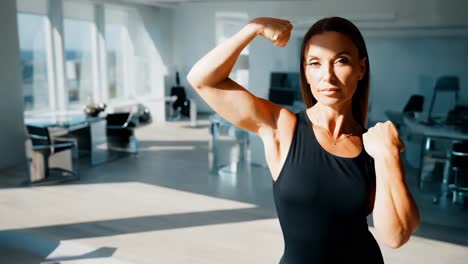 woman flexing in modern office