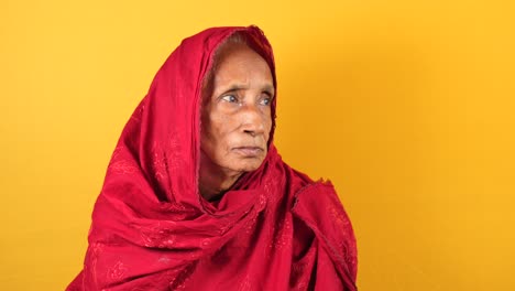 elderly woman in red scarf