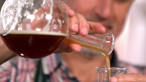 brewery worker checking the product