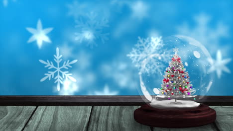 animación de globo de nieve con árbol de navidad en superficie de madera y paisaje de invierno con nieve
