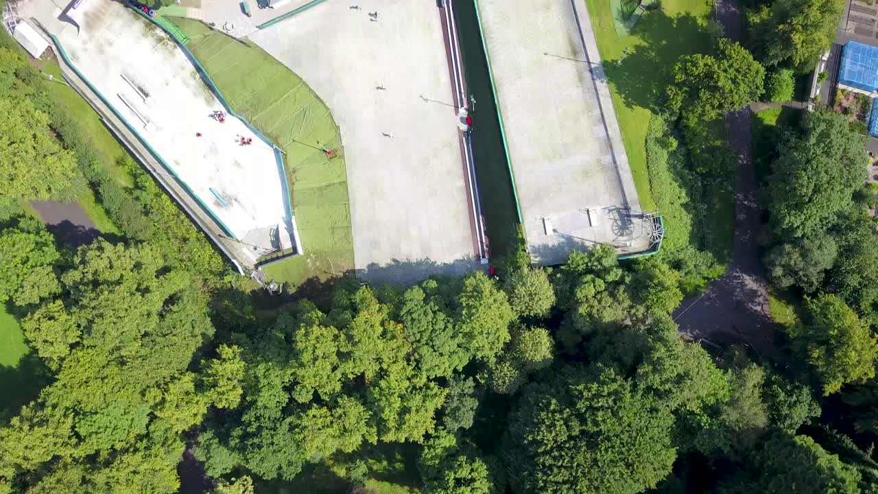Flying over a drone ski slope in a park
