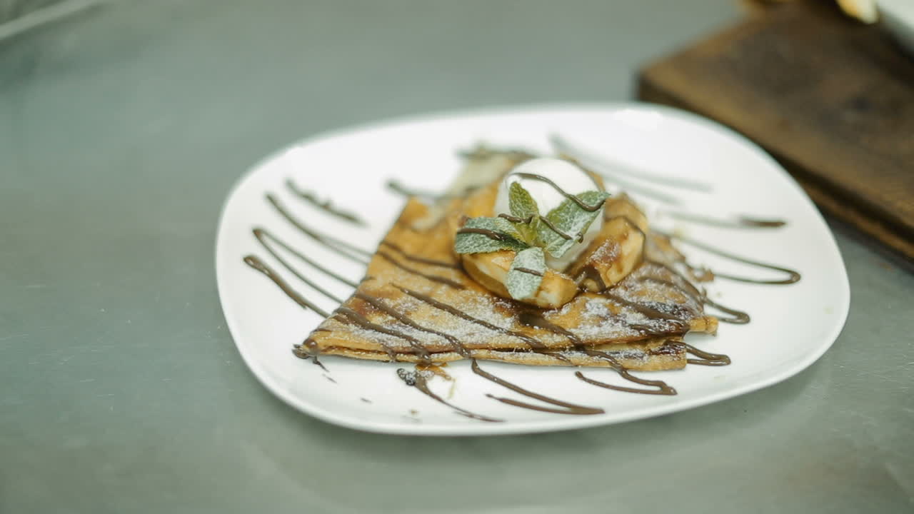 Chef In Restaurant Kitchen Cooking. Chef cook in uniform at the restaurant kitchen
