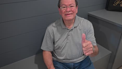 older man ties his shoes while sitting down on a diy bench in his home